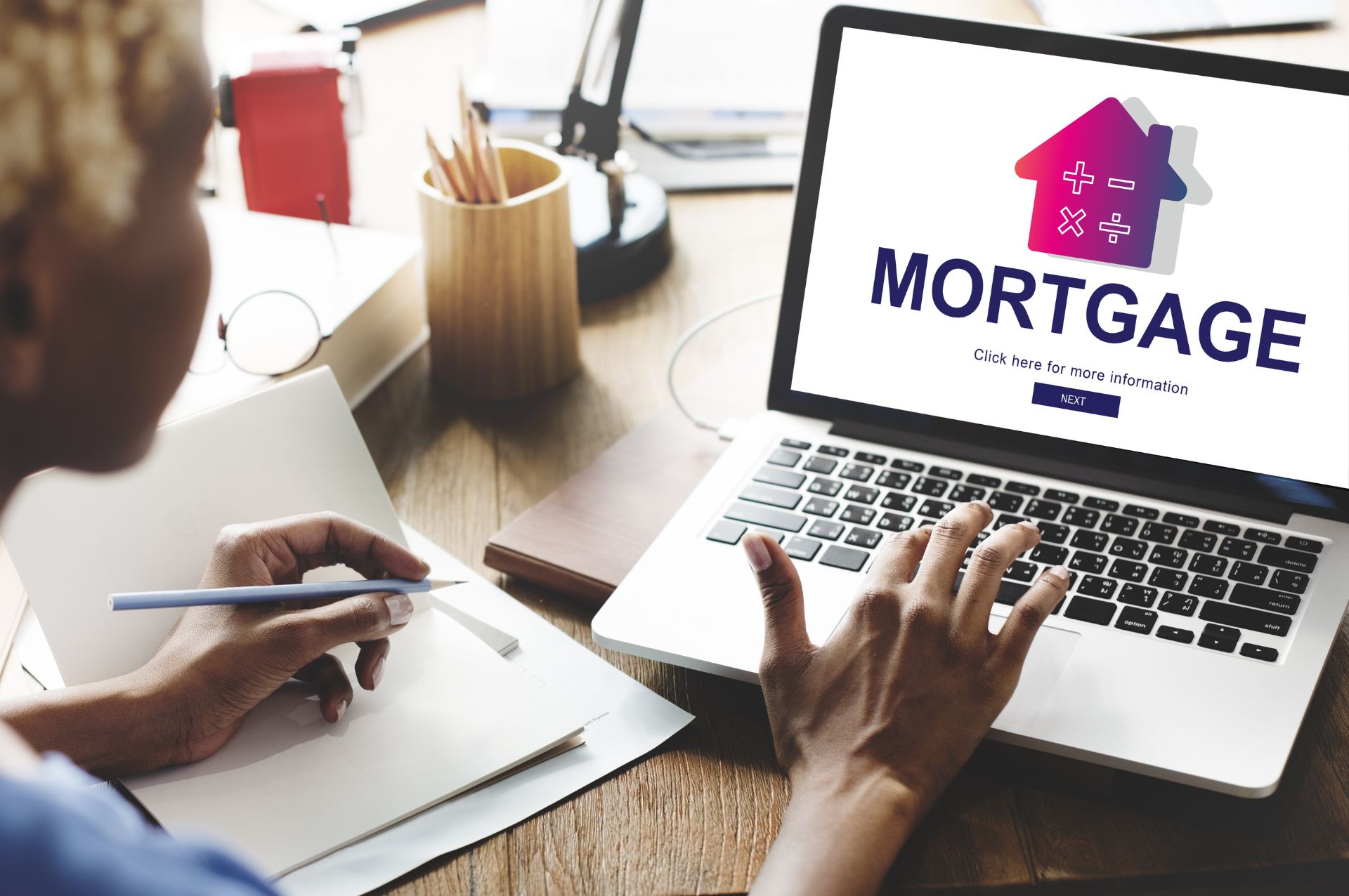 Using a laptop to look for a new mortgage deal